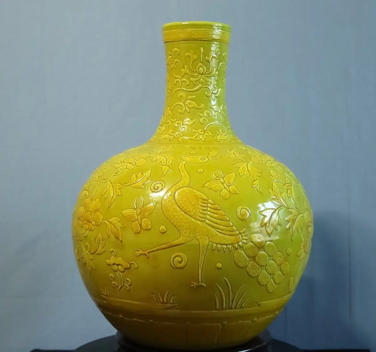 Chinese porcelain yellow glaze embossed celadon bottle