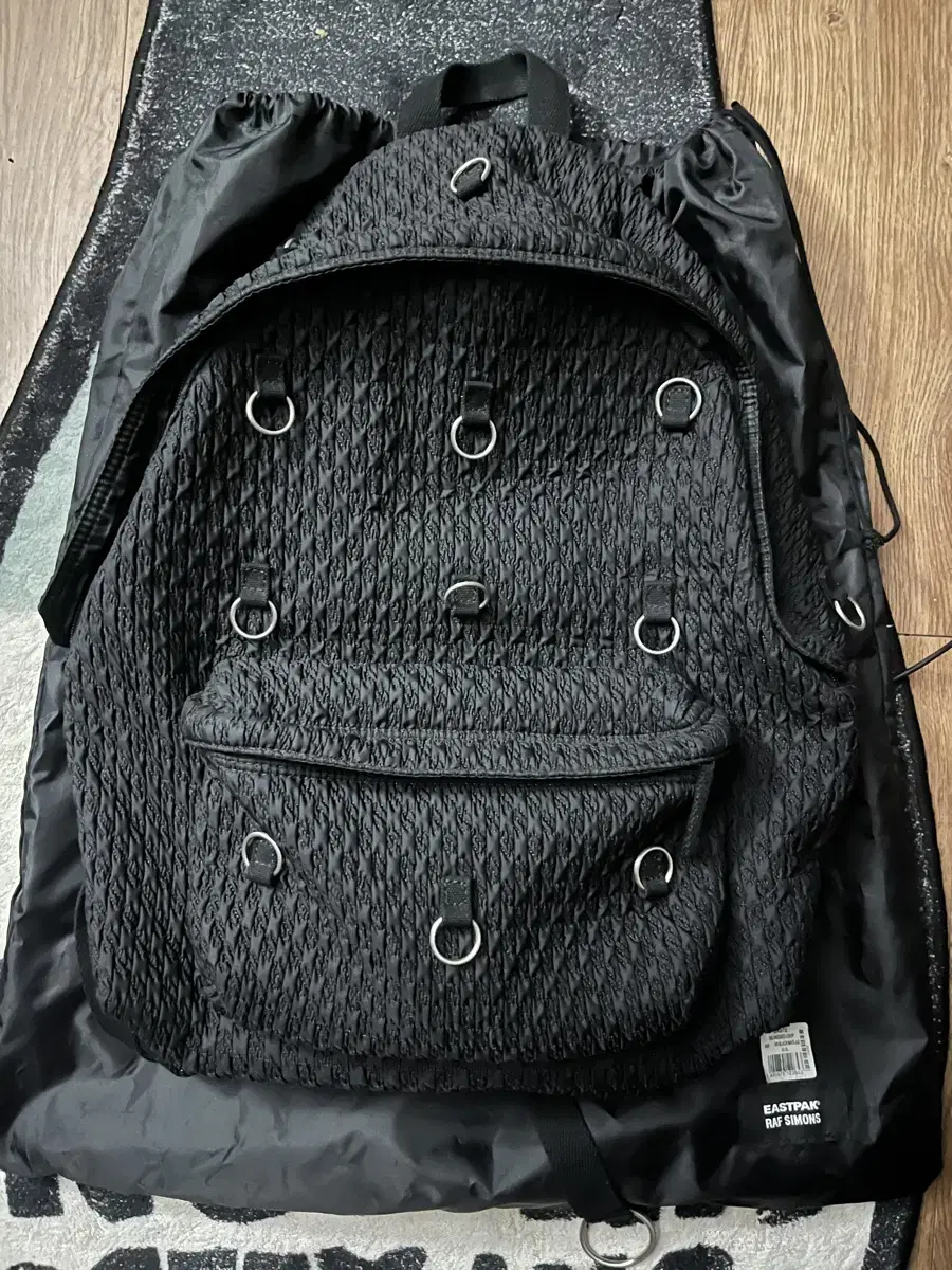 라프시몬스 X 이스트팩 패디드 백팩