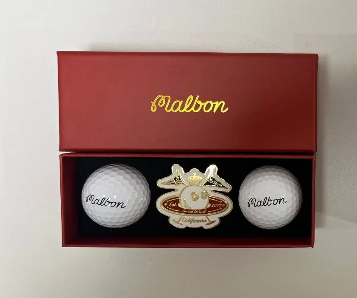 I'm selling a set of Malbon Space Ball Marker & 2 Golf Balls.