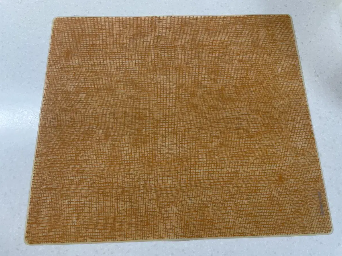 We are selling a set of two modern twist silicone table mats.