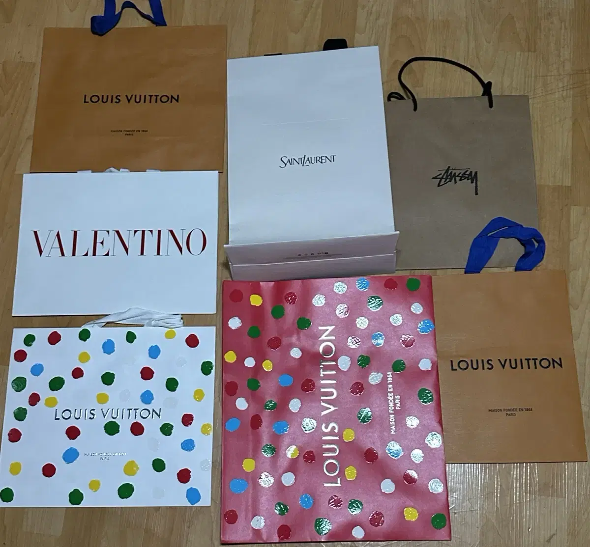 Louis Vuitton Saint Laurent Valentino Stussy Dior luxury shopping bag