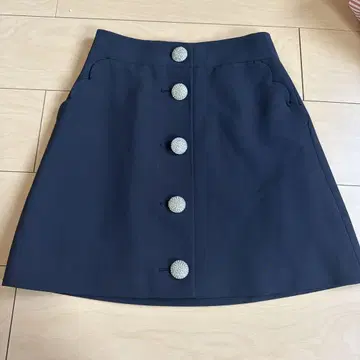 kate spade 비쥬 버튼 사다리꼴 스커트 스캘럽