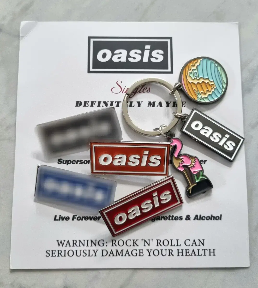 Oasis official website keyring badge