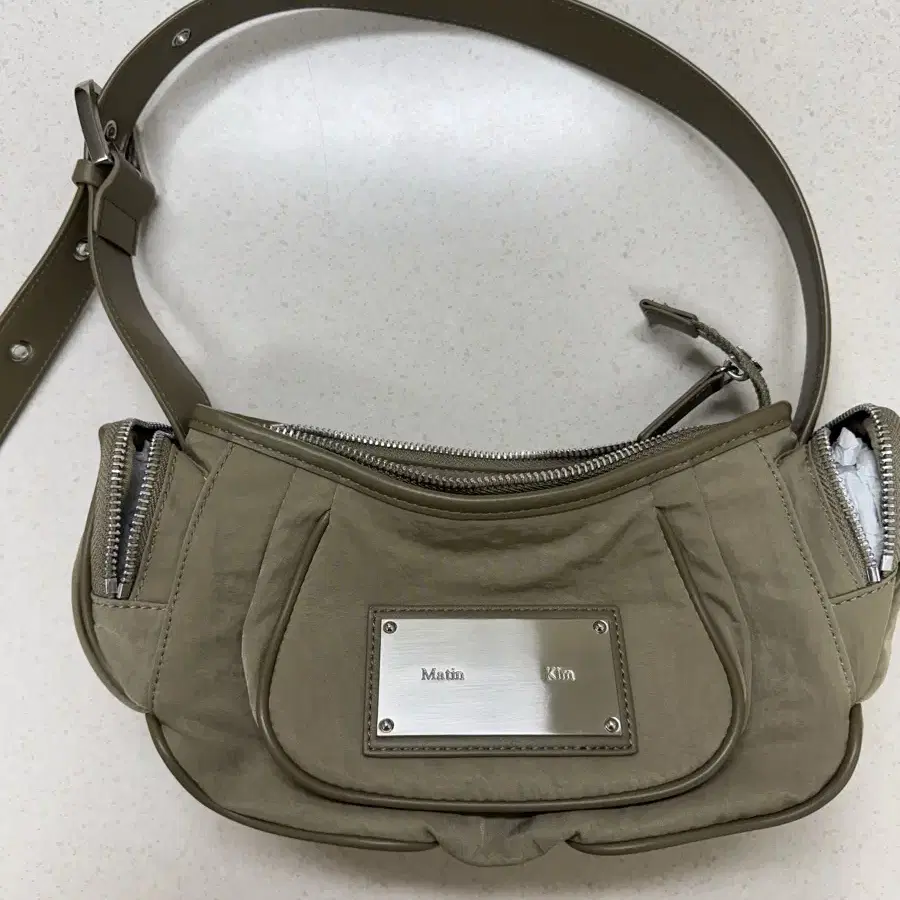 MATIN KIM | 마뗑킴 Matin Kim Madeleine Round Bag Khaki #마