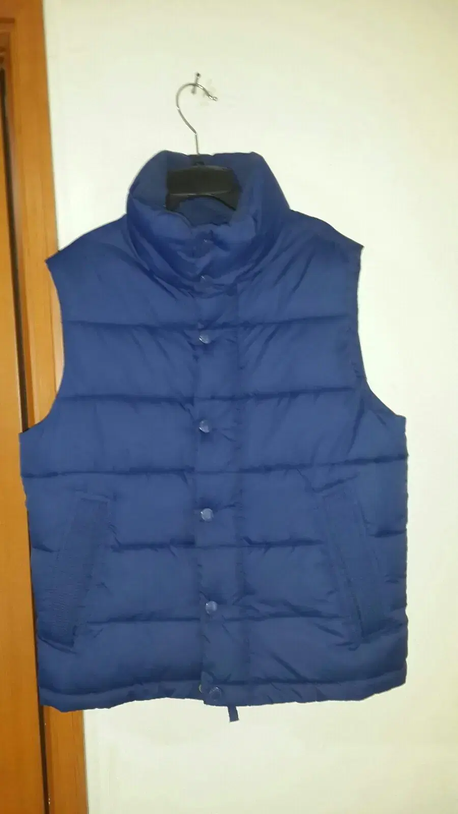 [95] Puffy padded vest.