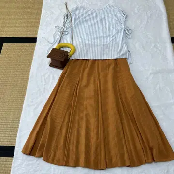 리브 소재 오렌지 플레어 스커트