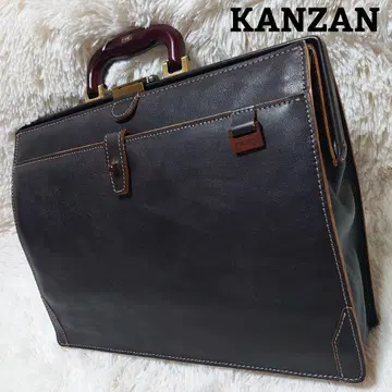 KANZAN 칸잔 오리엔트 슈링크 가죽 더레스 백 우드 핸들