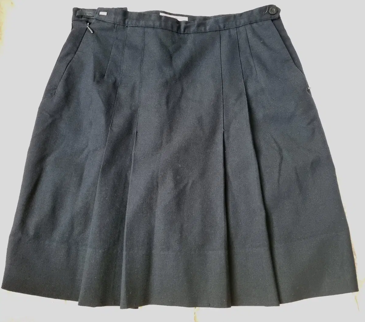 Two school uniform skirts