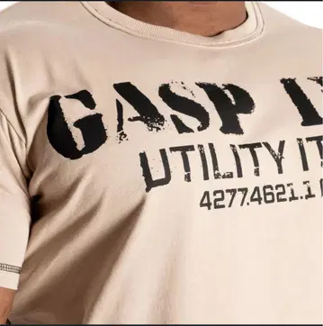 GASP INC. 베이지 티셔츠 구제 의류입니다.