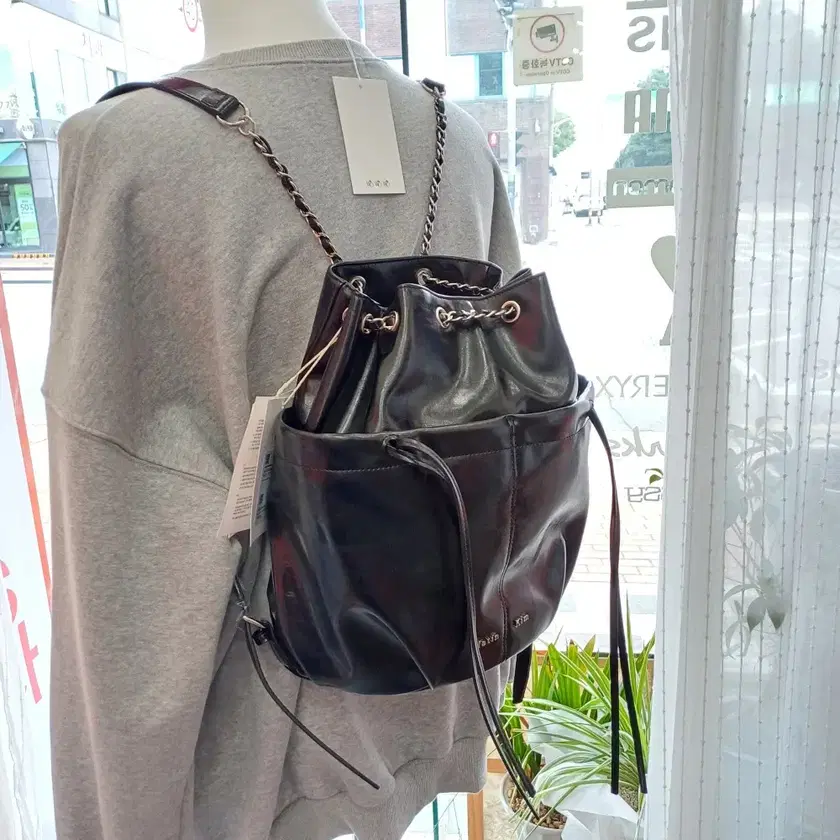 MATIN KIM | 마뗑킴 Matin Kim Drawstring Ribbon Backpack