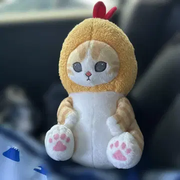 오렌지색과 크림색의 봉제 인형