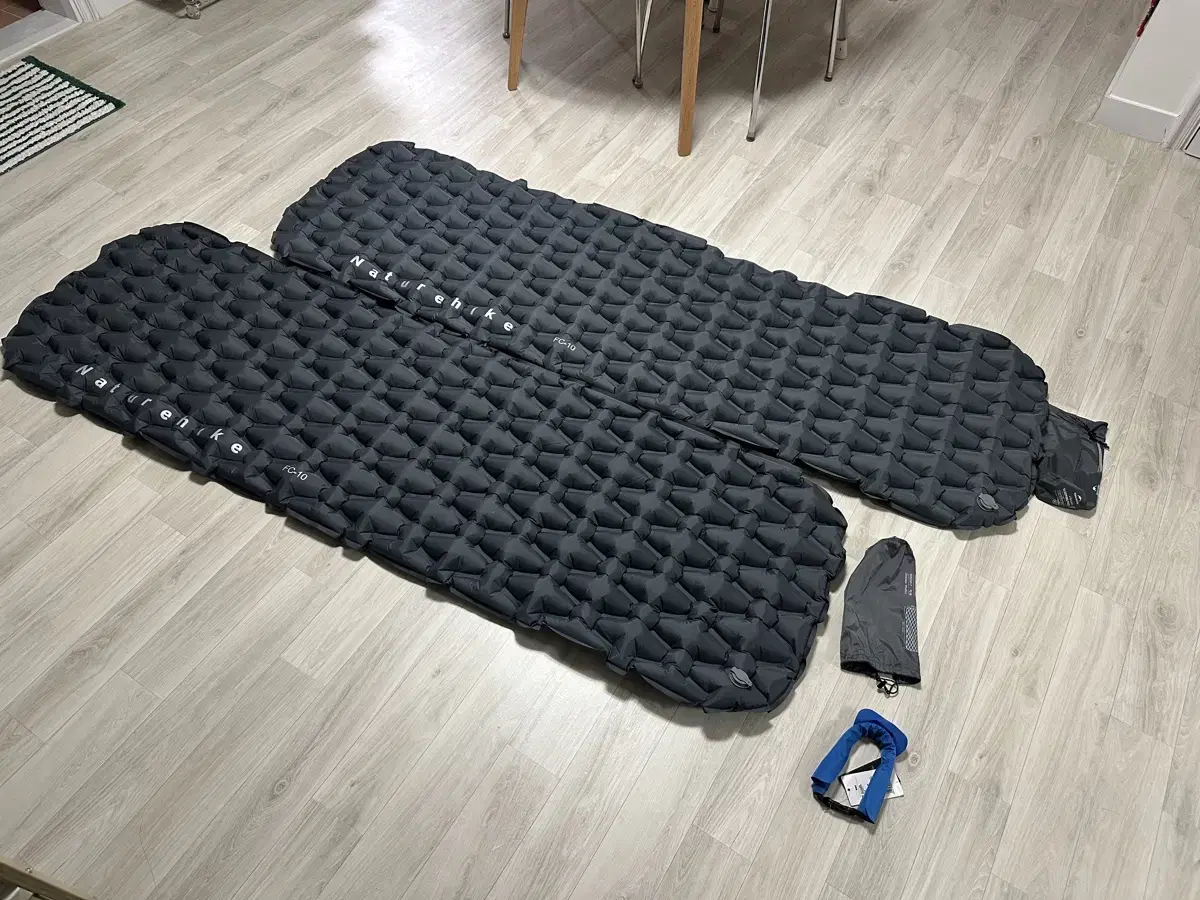 Two Naturehike air mattresses and an air bag