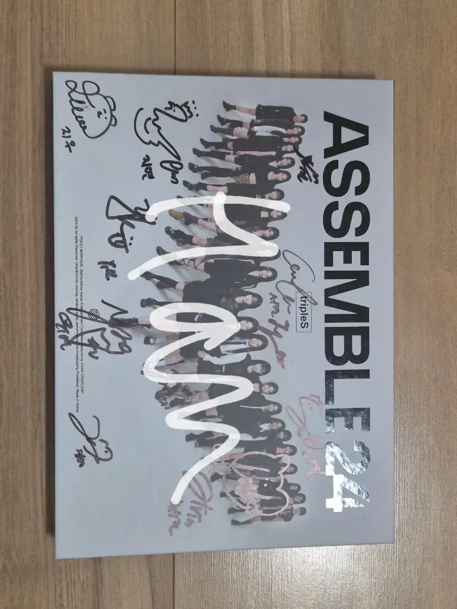 Triples Signed Album