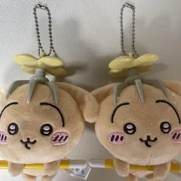 프로펠러가 달린 베이지 봉제 인형 마스코트