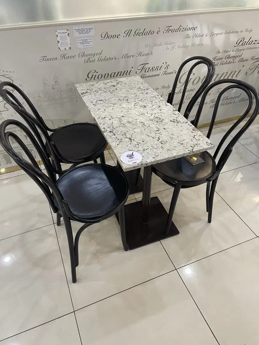 Two cafe table and chair sets for quick sale.