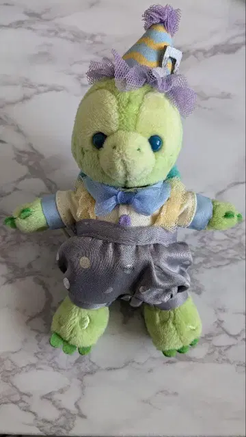 올멜 인형 배지