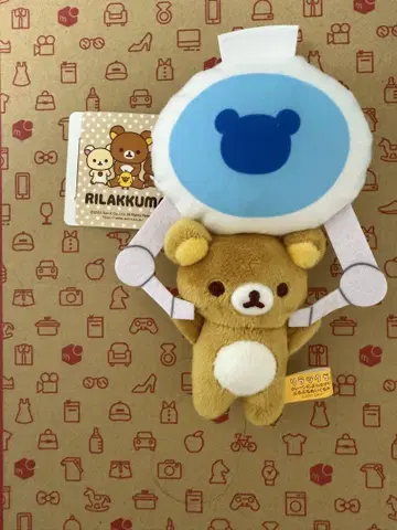 리락쿠마 크레인에 매달려 흔들리는 봉제 인형 리락쿠마