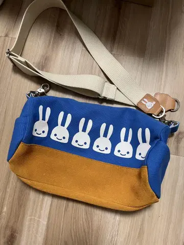 CUNE 캔버스 롤 숄더백