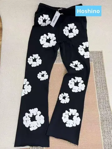 DENIM TEARS 프린트 아메리칸 하이 스트리트 마이크로 플레어 팬츠