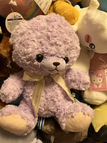 보라색 리본이 포함된 봉제 인형 약 30cm