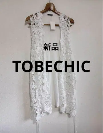 새상품 TOBECHIC 화이트 슬리브리스 베스트