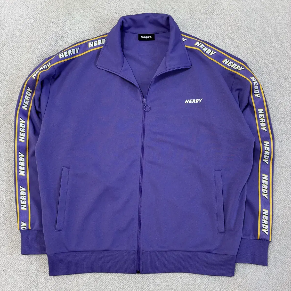 NERDY | 널디 Nerdy Taping Logo Tracktop Purple Jersey S