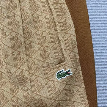 Lacoste 모노그램 자카드 트랙 팬츠 베이지