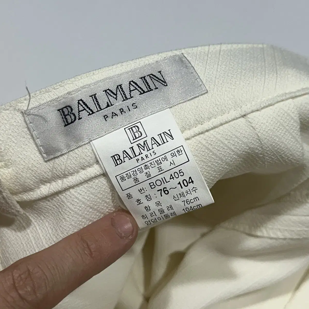 スカート BALMAIN Woman Skirt White EF1LD022KI10 0FA BALMAIN Short Asymmetric Draped Skirt in Gris Clair | FWRD