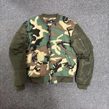 CORVIDAE / STITCHED WOODLAND CAMO BOMBER