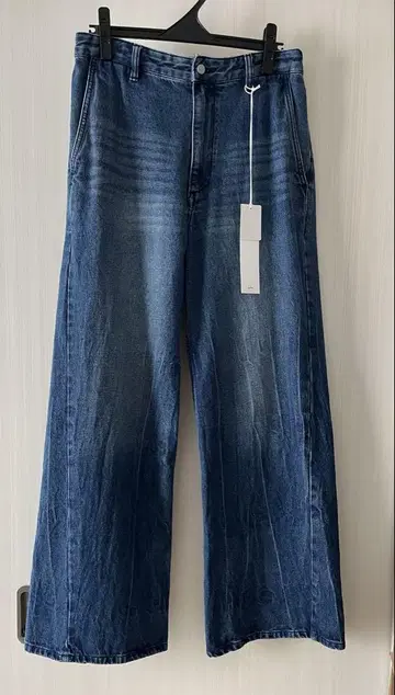 CURVED FLARE DENIM SLACKS