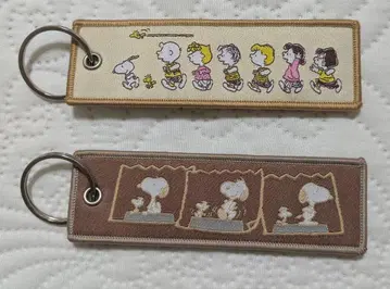 [PEANUTS] 플라이트 택 키링 스누피 라떼 컬러