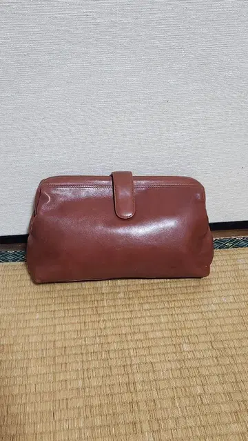 CASTELLANI 브라운 가죽 클러치백