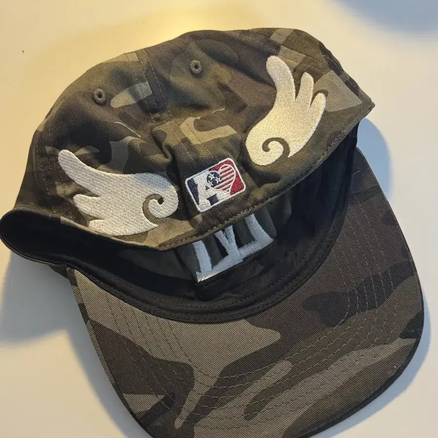 AEAE | 에이이에이 aeae ae Symbol Angel Wing Cap Camo Size 1