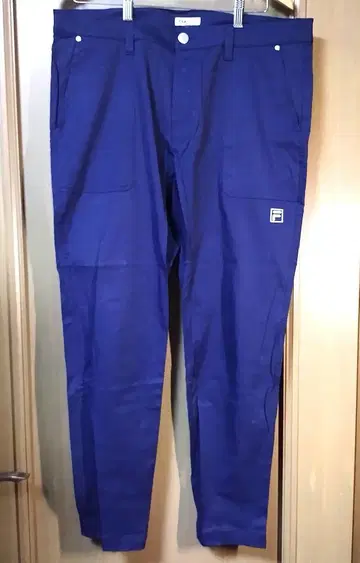 FILA 네이비 슬림핏 팬츠