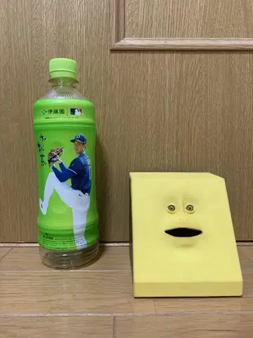 유니크한 얼굴의 옐로우 컬러 저금통