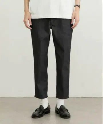 New Balance MET24 슬림 테이퍼드 팬츠 JMPL1597