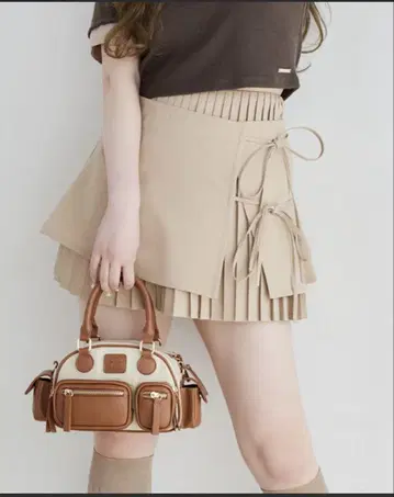 NICE CLAUP 레이어드 랩 플리츠 미니 스커트