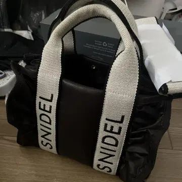 스나이델 로고백