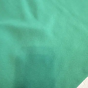 크레이프 원단 무지 염색 착척 1단 에메랄드 그린, 가드 가공 완료