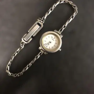 SEIKO 1E20-2150 라운드 화이트 다이얼 여성용 손목시계