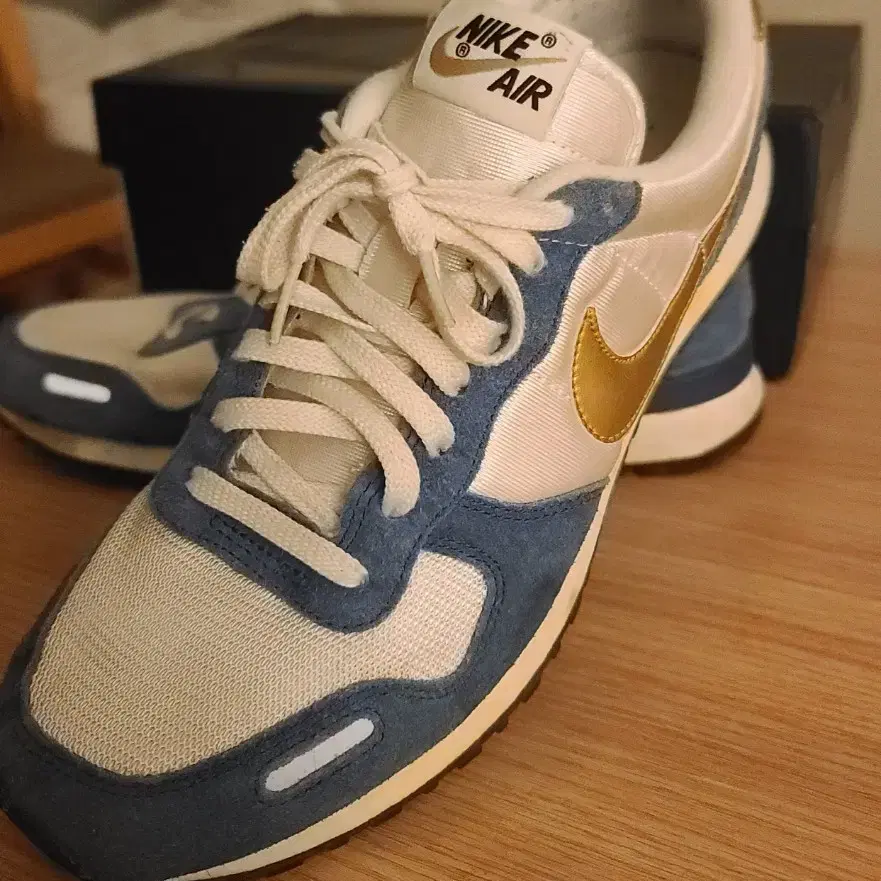 nike vortex blue gold