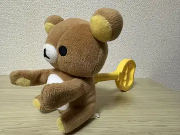 리락쿠마 안고 있는 봉제 인형 매직 핸드 레트로