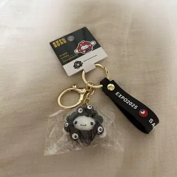 오사카 만박 한정판 산리오 변신 키링 블랙 미야쿠미야쿠 시나몬