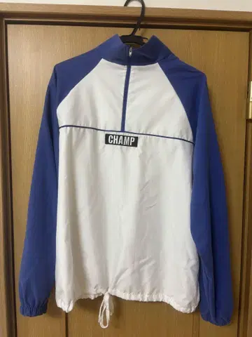 CHAMP 하프 지퍼 나일론 자켓
