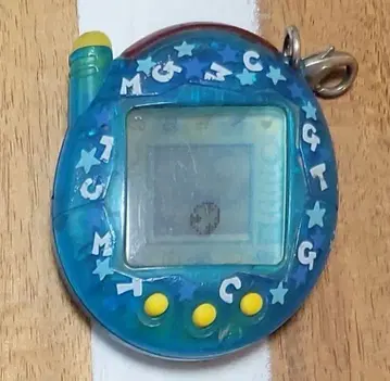 다마고치 파란색 별 모양 장식 포함