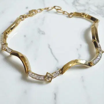 SWAROVSKI 스와로브스키 팔찌 골드 x 클리어 스톤 새상품급