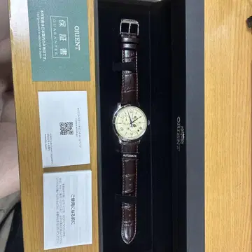 ORIENT Bambino 선앤문 자동 와인딩