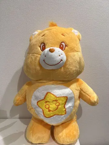 케어베어 봉제 인형 옐로우 컬러 별