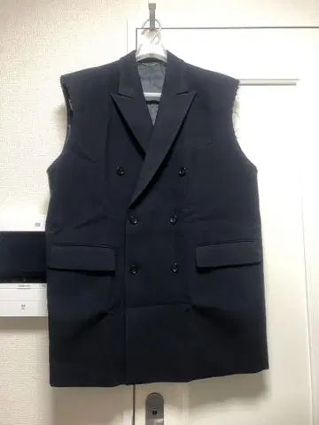 존 로렌스 설리번 슬리브리스 오버 테일러드 자켓 베스트