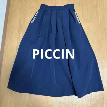 PICCIN 네이비 스커트 펄 버튼